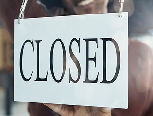 Image showing Closed, sign and window of a coffee shop closeup for small business commerce or service in the food and beverage industry. Cafe, glass and poster for retail or hospitality at a startup restaurant