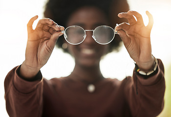 Image showing Woman, hands and closeup of glasses for vision, prescription lens for fashion and eyesight. Frame, optometry and person with optical eyewear for eye care, ophthalmology and health in optician test