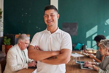 Image showing Smile, portrait and a man in a meeting with arms crossed for coworking and business pride. Happy, office and a mature businessman with confidence in professional team and career in the workplace