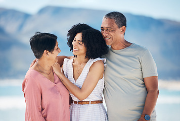 Image showing Beach, senior parents and woman in hug together with smile, love and sky on summer holiday in Mexico. Embrace, happy family support and mature mom, dad and woman on ocean holiday travel in nature.