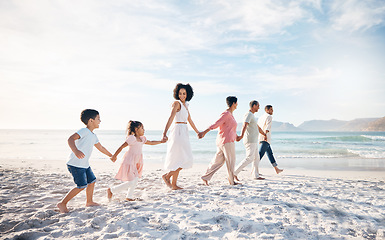 Image showing Big family, holding hands and walking at the beach for travel, vacation and adventure in nature. Love, freedom and children with parents and grandparent at sea for fun, journey and bond ocean holiday