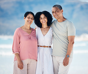 Image showing Beach, portrait of senior parents and woman together with smile, love and hug on summer holiday in Mexico. Embrace, happy family and mature mom, dad and daughter on ocean holiday travel in nature.