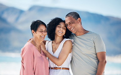 Image showing Beach, senior parents and adult daughter together with smile, love and hug on summer holiday in Mexico. Embrace, happy family support and mature mom, dad and woman on ocean holiday travel in nature.
