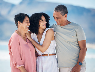 Image showing Ocean, senior parents and adult daughter together with smile, love and hug on summer holiday in Mexico. Embrace, happy family support and mature mom, dad and woman on beach holiday travel in nature.