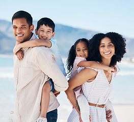 Image showing Parents, children and beach portrait with piggy back, care and love with adventure, freedom or holiday in sunshine. Father, mother and daughter with son, smile or outdoor for summer vacation by ocean