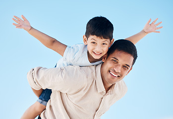 Image showing Portrait, piggy back and father with his son, outdoor and bonding with happiness, playful and fun. Face, happy dad carry kid or smile with travel, sun and summer vacation with love, support and care