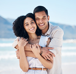 Image showing Happy, couple and portrait on beach in Brazil for holiday, vacation or travel for summer break at the ocean, waves or sea. People, smile and hug on tropical adventure together for marriage or love