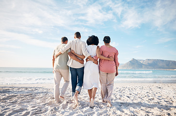 Image showing Back, hug and family at the beach for vacation, travel or relax by the ocean on holiday. Together, care and parents with adult people at the sea during summer for walking, love or support in nature