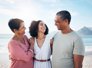 Image showing Ocean, senior parents and woman together with smile, love and hug on summer holiday in Mexico. Embrace, happy family support and mature mom, dad and adult daughter on beach holiday travel in nature.