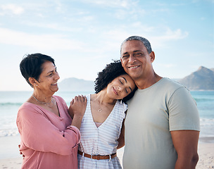 Image showing Beach, senior couple and adult daughter hug together with smile, love and blue sky on summer holiday in Mexico. Embrace, happy family and mature mom, dad and woman on ocean holiday travel in nature.