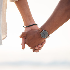 Image showing Love, couple and holding hands at the beach for support, hope and solidarity on nature closeup. Zoom, unity and hand holding by man and woman outdoor with care, empathy and trust, kindness or help