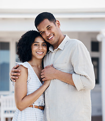 Image showing Couple, man and woman smile and hug outdoor in portrait, care and bond with support in marriage for young homeowners. Life partner, people and holding hands outside a house for happiness and trust