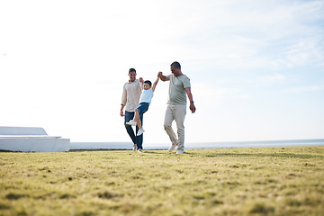 Image showing Dad, grandfather and boy with holding hands, playful and swing for bonding, generations or love on grass. Grandpa, father and son on holiday, vacation and family on lawn, adventure or summer sunshine