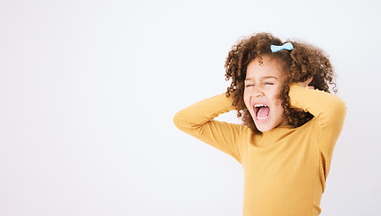 Image showing Screaming, loud and mockup with a girl child in studio on a white background covering her ears. Children, sound and audio with a young kid shouting or yelling on empty space for ADHD or autism