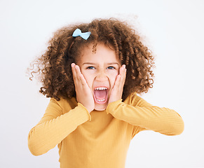 Image showing Child, hands on face and scream in studio for fear, bad news or announcement for horror or anxiety. Portrait of a young girl isolated on a white background and shouting while scared, terror or angry