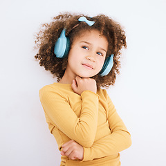 Image showing Music, headphones and kid thinking in studio isolated on a white background mockup space. Idea, radio and girl child listening to podcast, streaming audio and hearing media sound online on technology