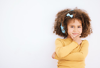 Image showing Child, headphones and portrait with music, radio streaming and web audio in a studio. Happy, young girl and kid with white background and mockup space for marketing with kids sound and listening