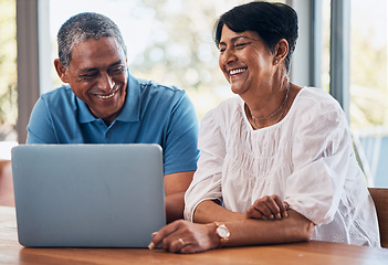 Image showing Conversation, laptop and senior couple with communication and bonding in the dining room. Happy, smile and elderly man ad woman in retirement browsing on social media with computer together at home.