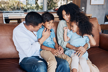 Image showing Happy, funny and relax with family on sofa for smile, bonding and peace on holiday. Love, care and happiness with parents and children in living room at home for vacation, cuddle and embrace together