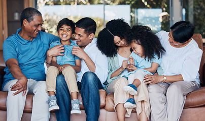 Image showing Smile, tickle and relax with big family on sofa for happy, bonding and peace. Love, generations and grandparents with parents and children in living room at home for vacation, cuddle and embrace