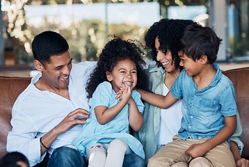 Image showing Happy, funny and love with family on sofa for smile, bonding and peace on holiday. Relax, care and happiness with parents and children in living room at home for vacation, cuddle and embrace together