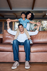 Image showing Smile, airplane and portrait with family on sofa for happy, bonding or peace on holiday. Love, care and playful with parents and child in living room at home for vacation, cuddle and embrace together