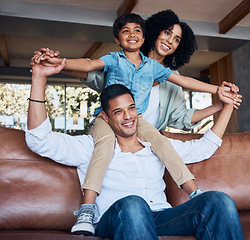 Image showing Smile, airplane and relax with family on sofa for happy, bonding or peace on holiday. Love, care and playful with parents and child in living room at home for vacation, hug and fun together