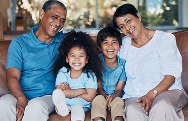 Image showing Happy, portrait and grandparents with children on sofa for smile, bonding and peace on holiday. Love, care and happiness with family in living room at home for vacation, cuddle and embrace together