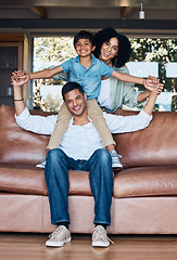 Image showing Support, airplane and portrait with family on sofa for happy, smile or peace on holiday. Love, care and playful with parents and child in living room at home for vacation, cuddle and embrace together