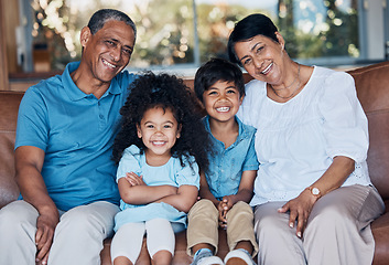 Image showing Smile, portrait and grandparents with children on sofa for happy, bonding and peace on holiday. Love, care and happiness with family in living room at home for vacation, cuddle and embrace together