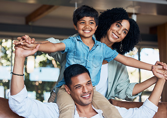 Image showing Smile, airplane and support with family on sofa for happy, bonding or peace on holiday. Love, care and playful with parents and child in living room at home for vacation, cuddle and embrace together