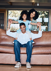 Image showing Relax, airplane and portrait with family on sofa for happy, bonding or peace on holiday. Love, care and playful with parents and child in living room at home for vacation, cuddle and embrace together