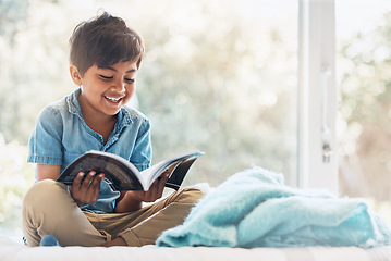 Image showing Boy, child and reading book in bedroom for learning, language development or studying literacy. Happy young kid relax with books for storytelling, hobby and knowledge of literature, education and fun