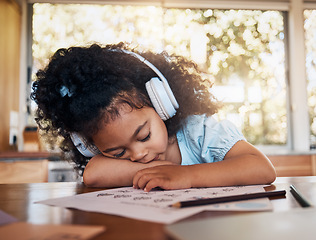 Image showing Home education, sleeping child and tired during kindergarten homework, remote learning and studying math. Music headphones, knowledge and relax young student, girl and kid fatigue, rest or burnout