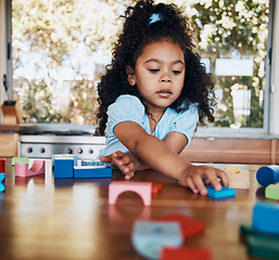 Image showing Girl, child and learning with building blocks in home for education, development and playing puzzle games for growth. Kid, play and toys for teaching creative skills and relax with educational game