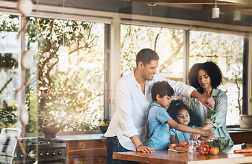 Image showing Parents, kids and cooking with vegetables, kitchen and helping hand for learning, nutrition and food in home. Father, mother and children with vegan meal prep, teaching and health in family house