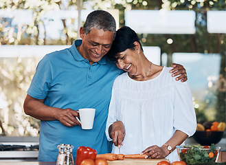 Image showing Couple, love and hug while cooking food, cutting vegetables and prepare carrot for salad at home. Mature man, happy woman and embrace in kitchen while making healthy lunch, meal and diet for dinner