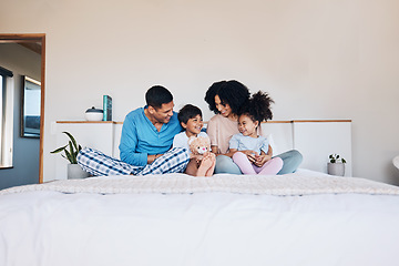Image showing Happy, smile and family on bed talking, bonding and relaxing together with love at their home. Happiness, excited and young children speaking to their parents from Colombia in the room of their house
