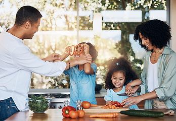 Image showing Cooking, health and funny with family in kitchen for learning, food and nutrition. Wellness, support and vegetable with parents and children at home for meal prep, support and dinner together