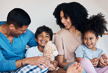 Image showing Smile, love and children with their parents on a bed for bonding, connection or playing with toys. Happy, teddy bear and family from Colombia talking and relaxing in the room of their modern house.