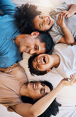 Image showing Above, laughing and portrait of a family on the bed for bonding, love and comic conversation. Together, house and parents with children for talking, jokes or funny communication in the bedroom