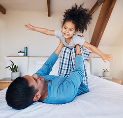 Image showing Airplane, smile and girl child with father on bed flying for fun, fantasy, and happiness in modern apartment. Family, play and face of young kid with dad in bedroom for quality time and bonding