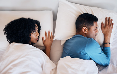 Image showing Frustrated couple, fight and lying in bed conflict, divorce or argument from disagreement or dispute at home. Top view of woman and man in breakup, cheating affair or toxic relationship in bedroom
