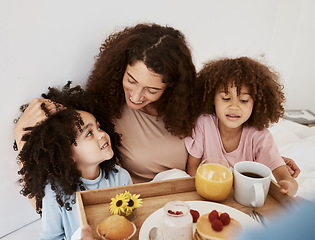Image showing Breakfast, mothers day and mom with kids in bed for birthday, celebration or special day. Interracial family, love and woman and children with healthy food on tray for wellness, nutrition or surprise