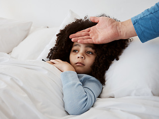 Image showing Sick, child and hand on head check for temperature, fever and disease in a bed with headache. Bedroom, tired and fatigue of a young kid with healthcare and flu problem with parent support and monitor