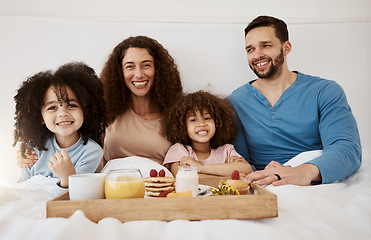 Image showing Happy family, kids and portrait of breakfast in bed, eating food and enjoy quality time together in home apartment. Smile, relax and bedroom children, mom and dad with meal, orange juice and pancakes