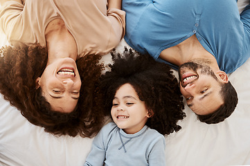 Image showing Bedroom top view, kid and happy family love, bond and enjoy wellness, rest or quality time with mama, papa or parents. Home bed, morning closeup and face of mom, dad and young child relax on mattress