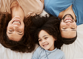 Image showing Bedroom top view, child and parents laugh, connect and enjoy quality time together, rest or funny joke, humour or comedy. Home bed, morning closeup and face of happy family kid, mom and dad wellness