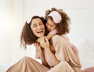 Image showing Mother, daughter and sleep mask, hug and bonding with love, care and laughter in the morning. Woman, young girl and smile at home with pajamas and family, positivity and fun together in bedroom