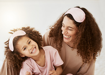 Image showing Mother, daughter and sleep mask, happiness and bonding with love, care and laughter in the morning. Woman, young girl and smile at home with pajamas and family, positivity and fun together in bedroom